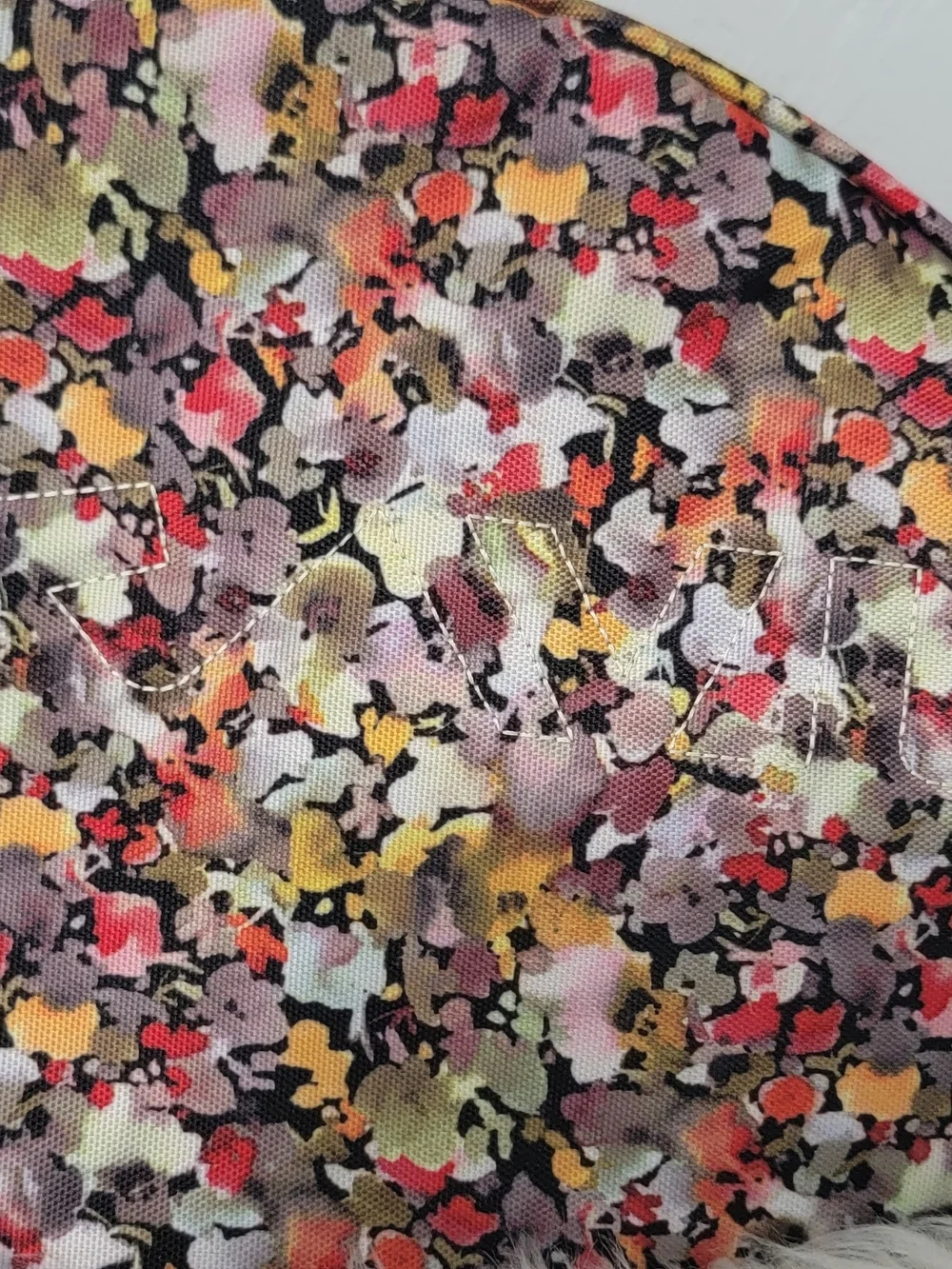 Kavu Floral-Pattern Sling Backpack in Pink, Yellow, Black, Cream